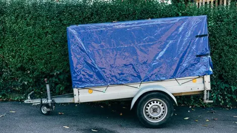 One dead after van struck by unchecked trailer