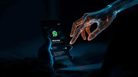 Moody whatsapp spy ghost hand reaching from linked laptop dark